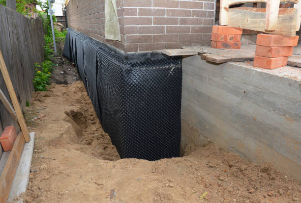 Happy homeowners after waterproofing job in Hicksville